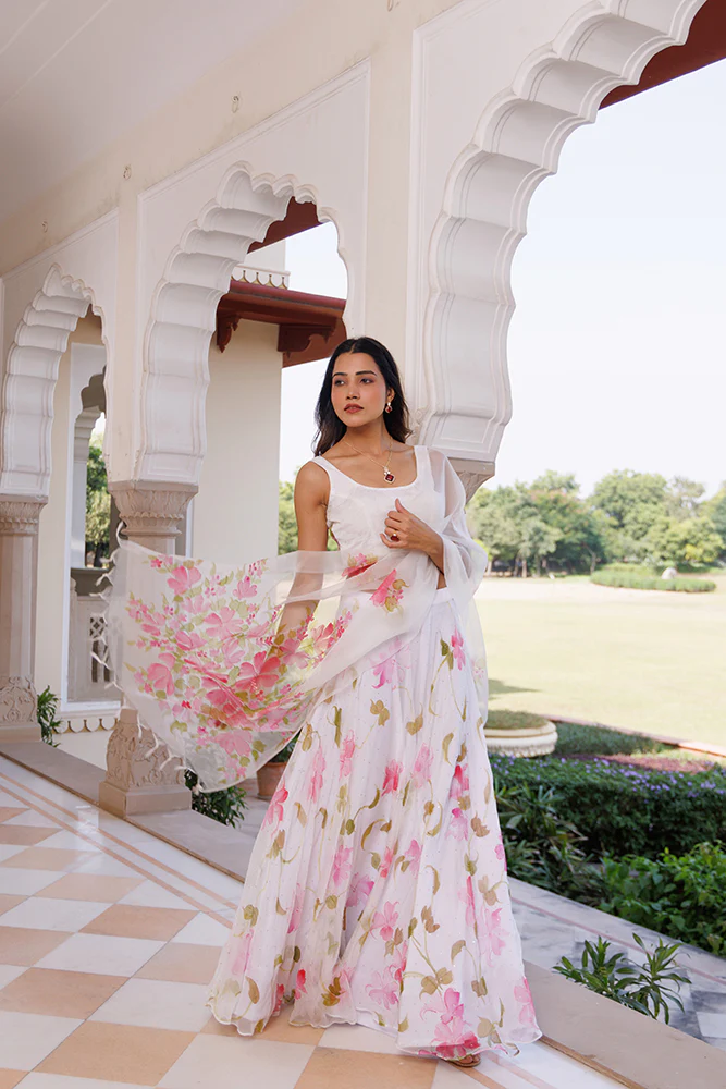 Luxury White Chiffon Lehenga With Mukaish Embellishment And Hand Painted Organza Dupatta