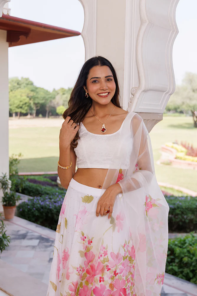 Luxury White Chiffon Lehenga With Mukaish Embellishment And Hand Painted Organza Dupatta