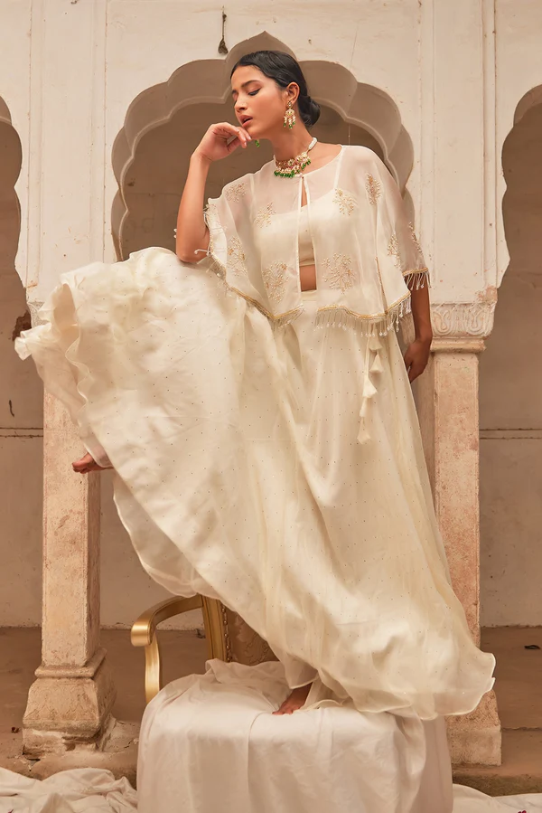 Off White Chiffon Mukaish Lehenga With White Hand Embroidered Cape