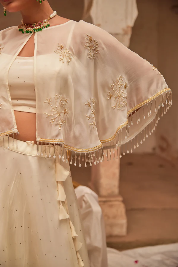 Off White Chiffon Mukaish Lehenga With White Hand Embroidered Cape
