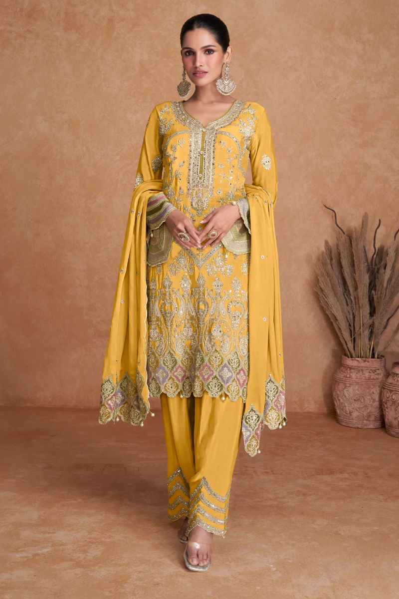Pakistani Style Full Embroidered Salwar Suit in Yellow Chinnon